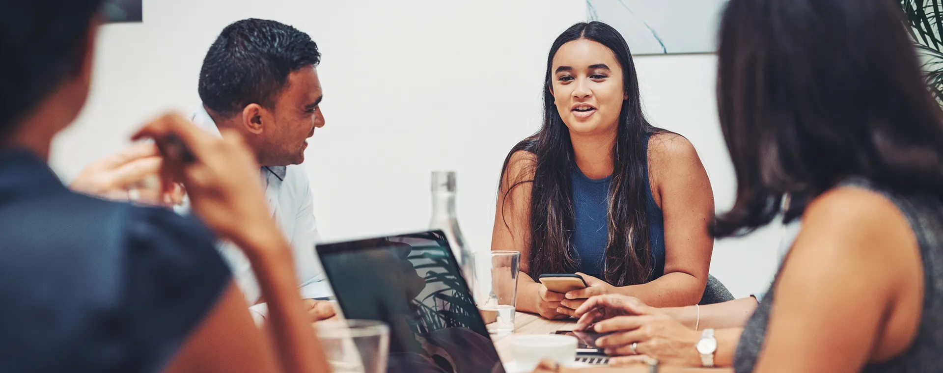 Individual leading conversation in meeting with multiple people