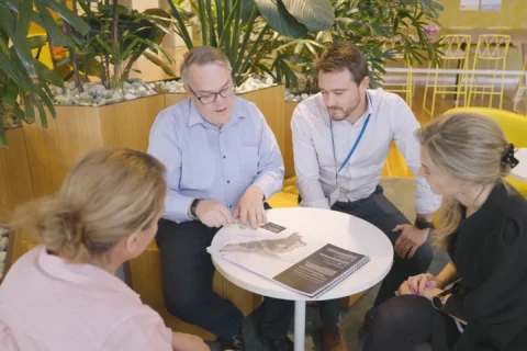 Industrial team having an in person meeting