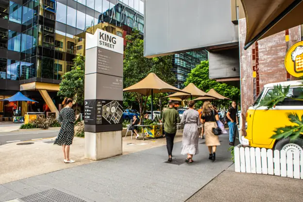 People walking around the commercial district at King Street in Bowen Hills PDA