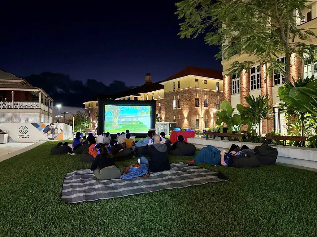 People at an outdoor cinema in the Herston Square activation space
