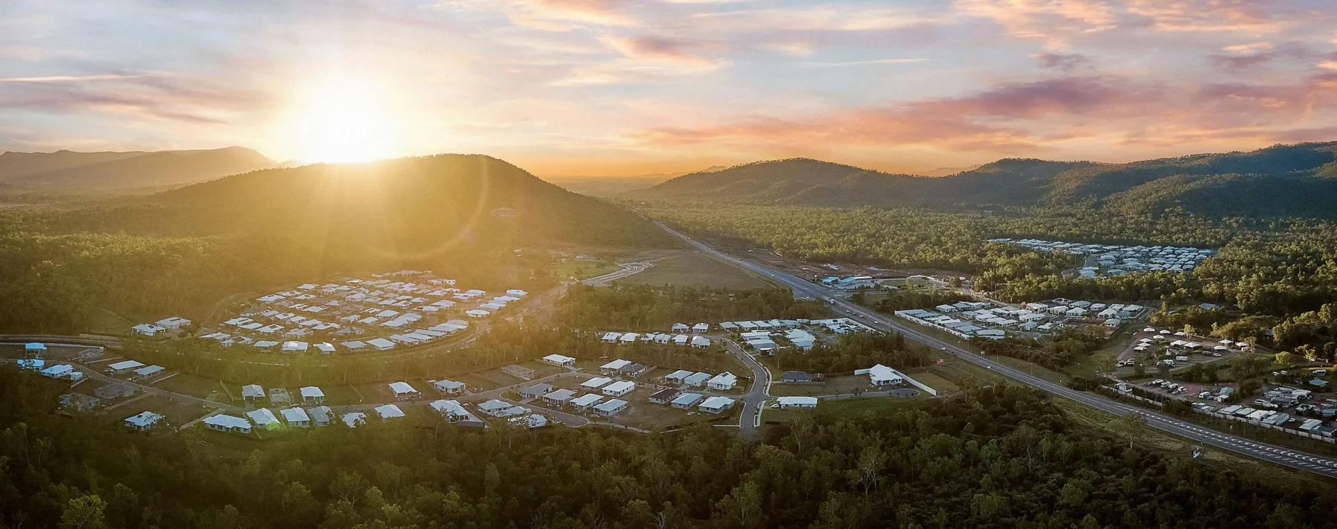 Aerial photo of a housing development in Townsville, with completed houses as well as houses under construction